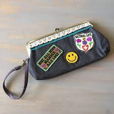 NOT ALL WHO WANDER ARE LOST WRISTLET/CLUTCH